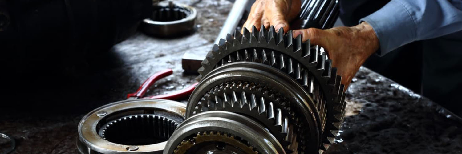 In this picture, an expert technicians is repairing car differential of a luxury car in Dubai